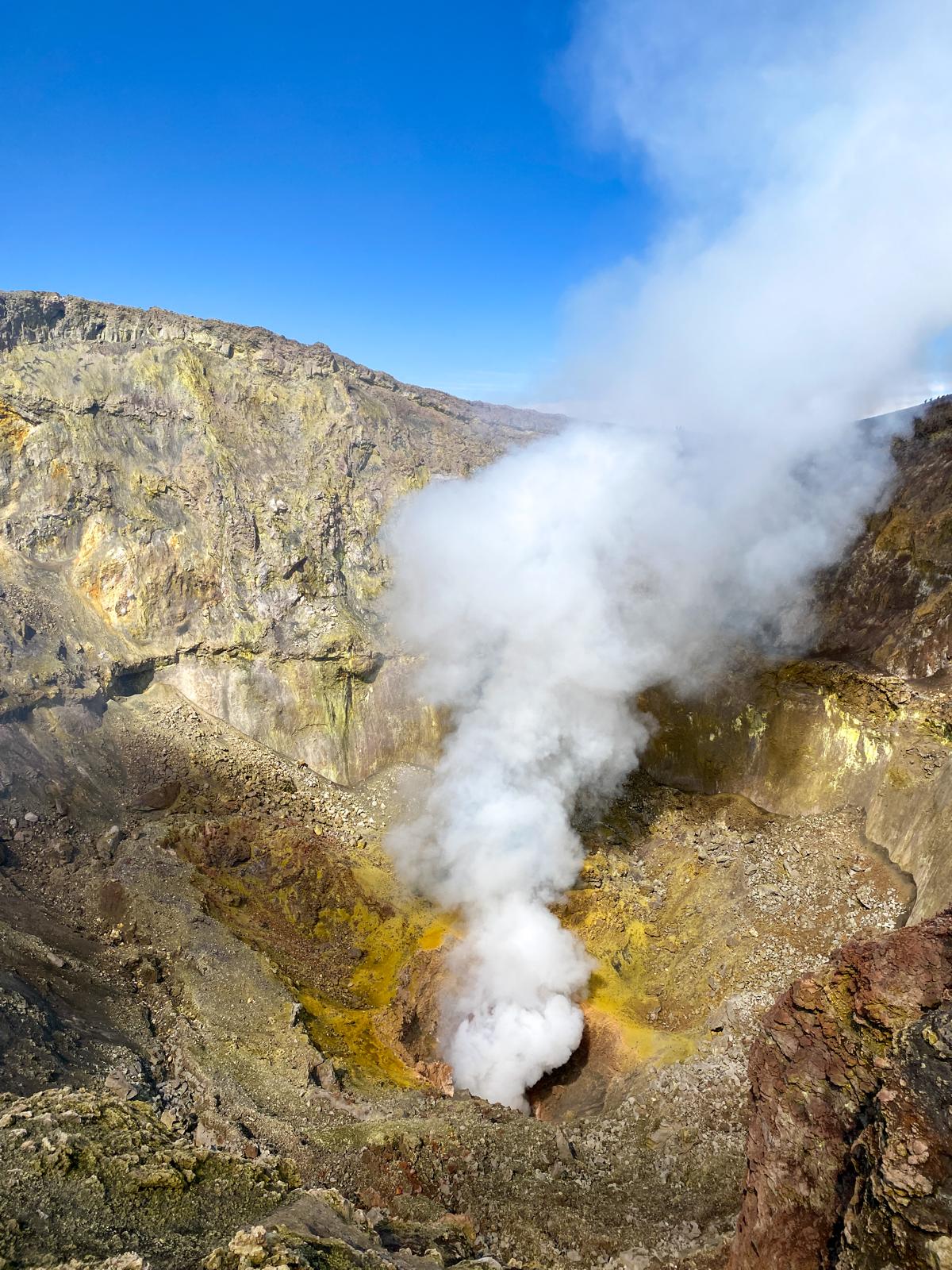 Volcanic fumes on the rim of Etna's summit craters