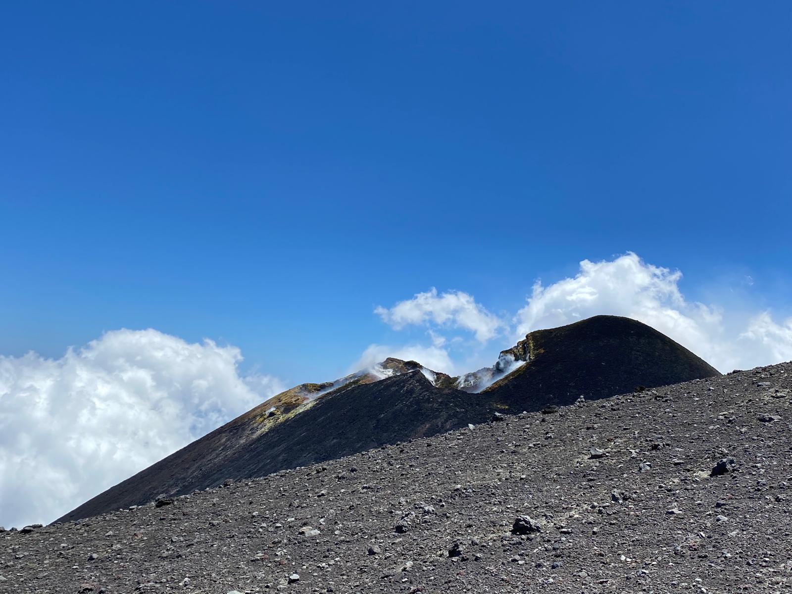 Group hiking on Etna's summit craters