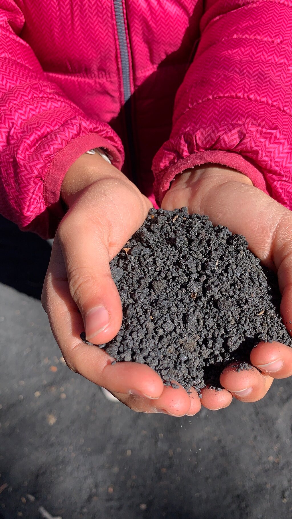 Etna's lava sand in the hands
